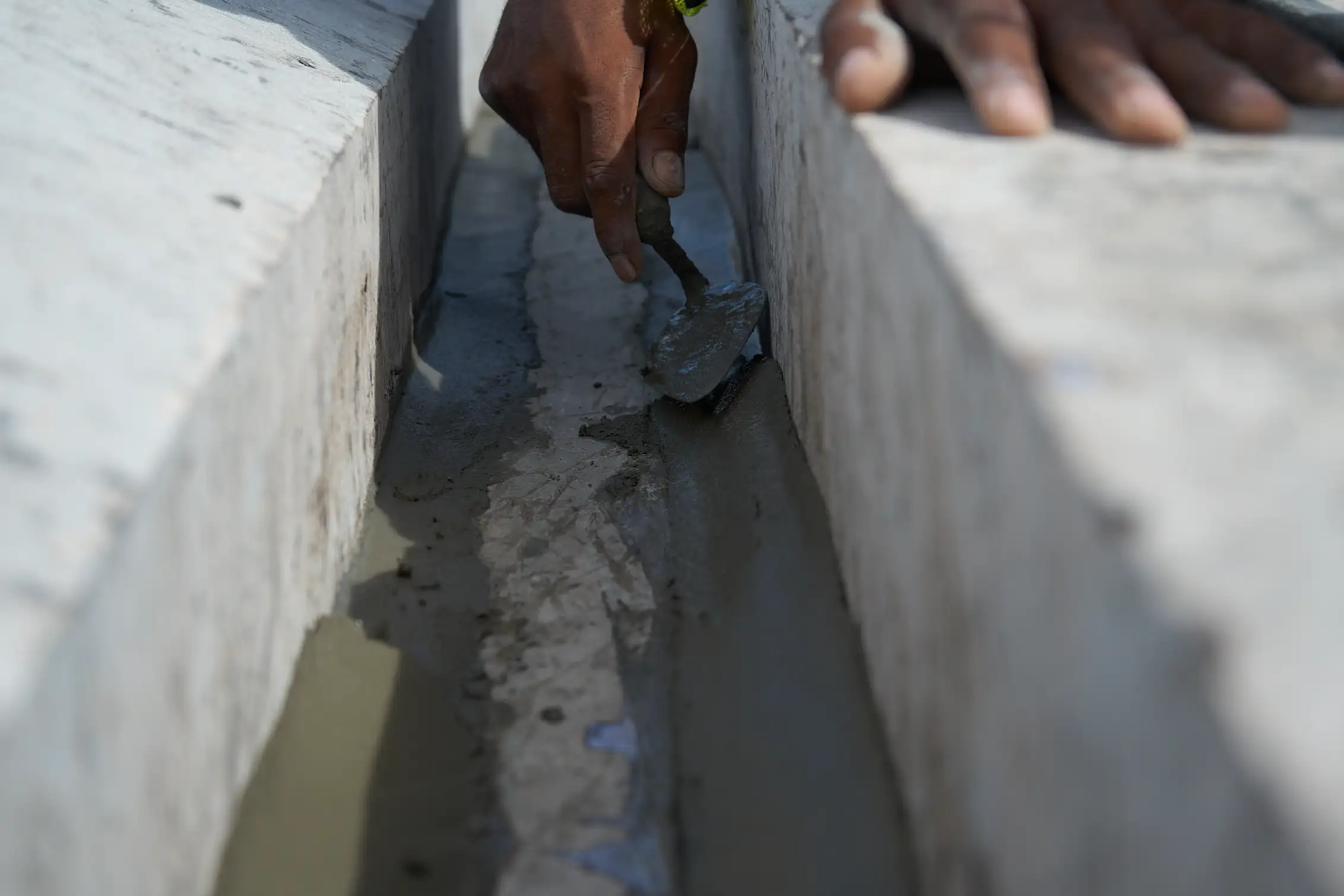 Close-up concrete joint and edge repair work